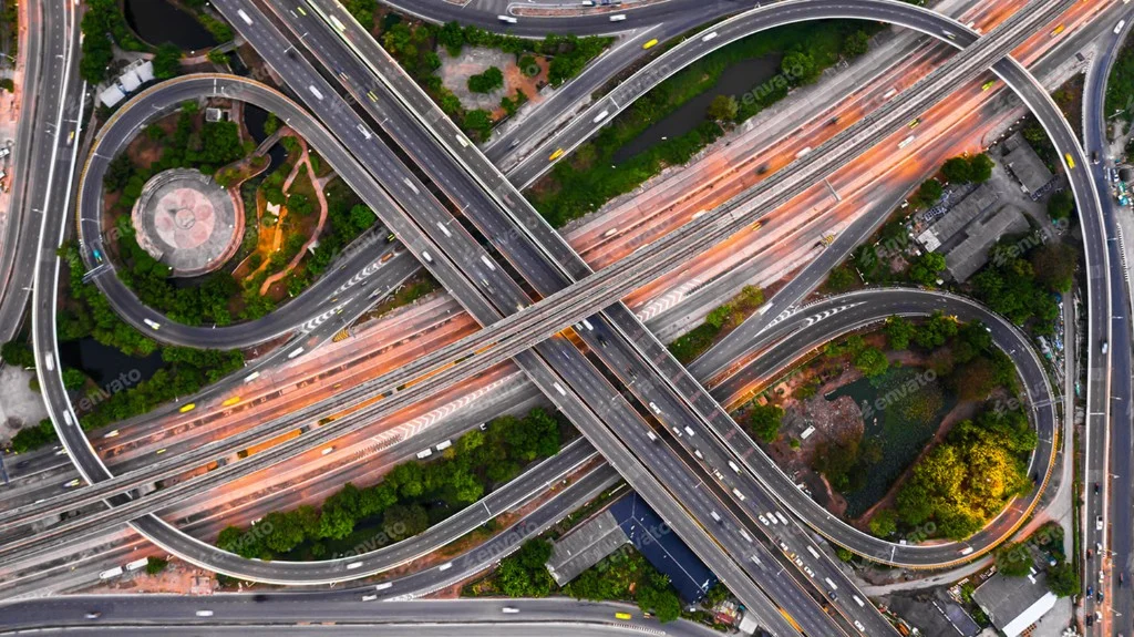 Aerial view of a connected highway interchange representing smart transport infrastructure