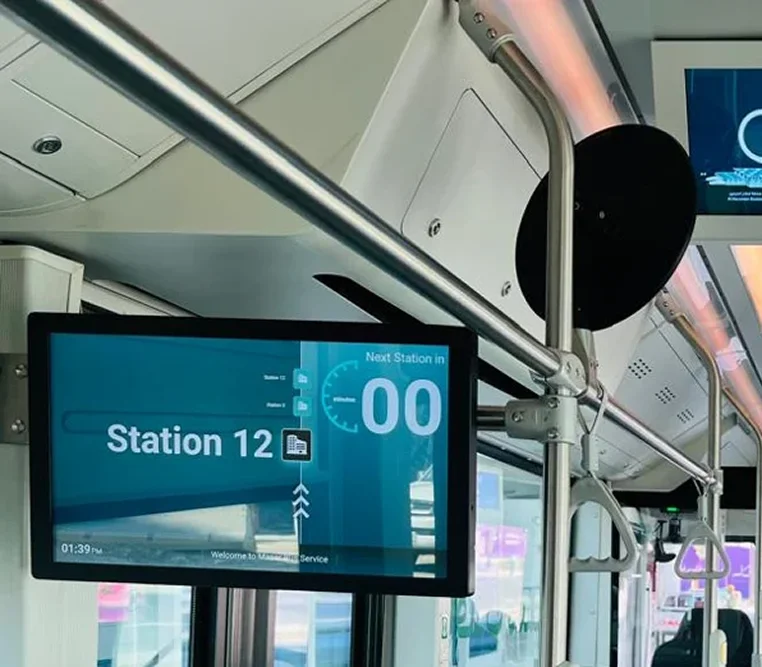In-vehicle RTPI screens showing next station and route map inside a transit bus